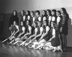 Adams is pictured with the first Eastridge High School varsity field hockey team in the fall of 1970 in Irondequoit. Adams taught physical education and both instituted and coached girls sports teams there. She was inducted into The College at Brockport State University of New York's Athletic Hall of Fame in 1993.