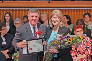 Bonnie Ross, executive director of Ontario County Partnership, is honored by state Senator Rich Funke with the 2015 Woman of Distinction Award.