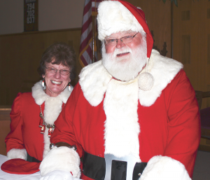 Santa and Mrs. Claus: Walt Krehling and his wife, Mary. Left photo: business card, gloves.
