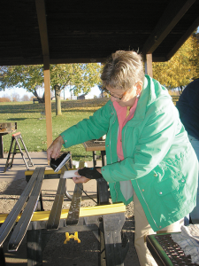 Trudy Munding waxing her skis in preparation for skiing. She is one of Huggers Ski Club’s 300-plus members.
