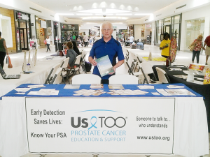Penfield resident Patrick Fisher, finds a new calling in life after surviving prostate cancer. Here he stands at the a local mall distributing literature about prostate cancer. 