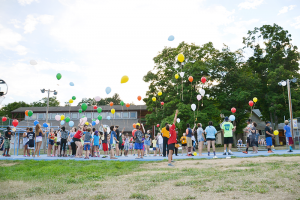 Campers at Camp Good Days and Special Times launch more than 100 balloons over Keuka Lake in Branchport during a summer program for children who have lost a parent or sibling to cancer. Photo provided.