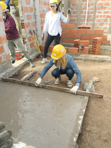 Williams smooths out cement at a Habitat for Humanity project in Argentina, where she spent two weeks.Photo provided.