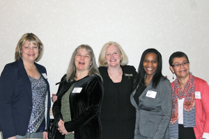 Nancy Bennet, middle, with some of her staff members from the Center for Community Health, during a recent event sponsored by the Monroe County Medical Society, which recognized Bennett with its Edward Mott Moore Award.
