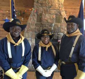 Buffalo Soldier color guard Robert Burgess, Shirley Boone and Bing Reaves, a retired police officer who helps run the group. Photo by Christine Green