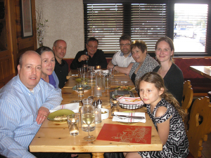Mangione (center, back) at Wegmans East Avenue during the pre-screening get-together for Gli Ultimi Sarrano, which was shown on May 24. Mangione briefly joined the DeCarolis family and some friends at the table.
