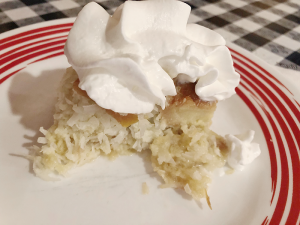 Olives’ coconut bread pudding is coconut and apricot, topped with a dollop of whipped cream.