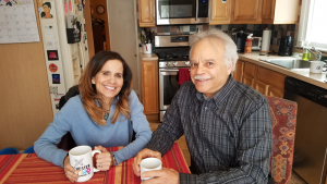 Annette Ramos and her husband at their home in Rochester.
