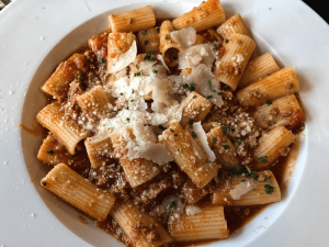 Edibels’ bolognese with veal, beef and pork top a pile of rigatoni pasta.