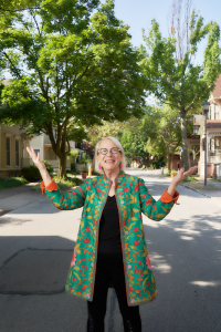 Suzanne Mayer in front of her home in the Grove Place neighborhood of Rochester on Aug. 2. Photo by Chuck Wainwright.