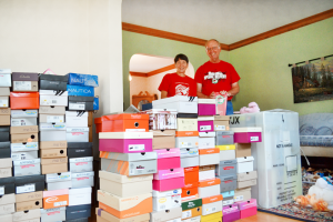 Joel and Pat Slesak of Greece have volunteered locally to get shoe boxes filled with school supplies, hygiene items and toys for needy children.