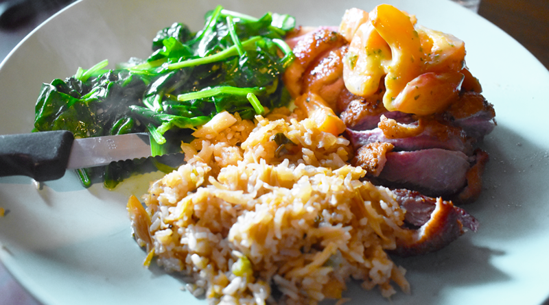 Red Dove Tavern’s duck breast ($28) with the apricot-miso salad, daily fried rice, and sautéed spinach.