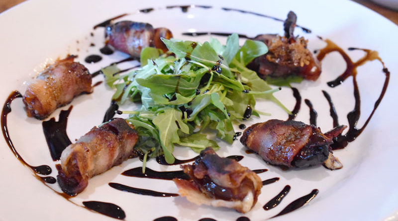 Bombs flavor: Bacon-wrapped dates with Manchego cheese and balsamic honey drizzle ($12).