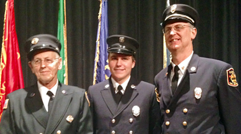 A very proud legacy: three generations of firefighters: Darwin Welker, from left, grandson D.J., and son John Welker.