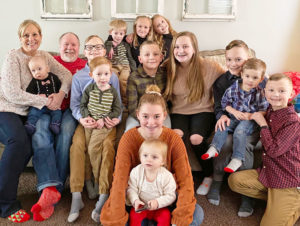 Kathryn and Gary Smith surrounded by their 13 grandchildren.