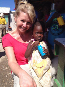 Ginny Ryan covering a story at an orphanage in Haiti in February 2015 