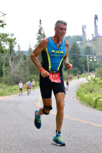 Rochester’s Mike McDermott, 58, competed at the Lake Placid Ironman event in 2019 — the last time the event was run because of the COVID-19. At 6-4, he’s got a long stride that aided him in the marathon-length run and the 40-mile cycling. Even though he was raised near the ocean in New Jersey, he had to learn how to swim competitively through classes and exercises through the Drop-Ins for Drop-Outs group and RATS (Rochester Area Triathletes). His ironman days are over, but McDermott is ready for more triathlons.