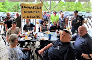The Damascus Shrine Wheelers met in Webster in May to discuss getting their minicars on the road. Yes, some of these big guys fit in those teeny cars. 