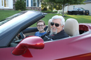 John Addyman in his Corvette with his grandson, Jeremy Loblaw. 