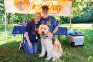 Susan and her husband Paul Anthony are the founders of RocDog, an organization that trains dogs to be therapy dogs. Next to them is their dog, Joshua, a 20-month-old goldendoodle.