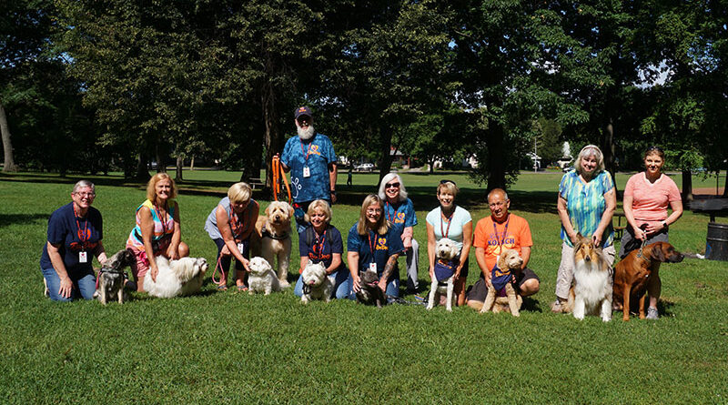 Photo: These happy canines brought their owners to Rochester’s Cobbs Hill Park last August for one of RocDog’s regular gatherings. Photo by Mike Costanza