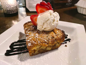 Bread pudding ($8): an apple fritter-style bread pudding with a scoop of Pittsford Dairy Farms vanilla ice cream.