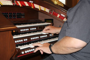 Tim Schramm plays the Rodgers 360 theater organ in his living room.