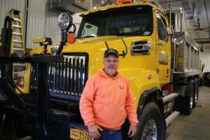 Greg Phillips stands beside his Number 11 truck. He’s been pushing snow for 20 years in the Town of Phelps. His truck was spotless on the day before the first accumulating snowfall in late November