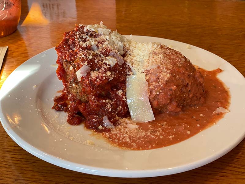 Pair of meatballs at ROAM: They are huge and come in a generous amount of house marinara. There was an unapologetic amount of shaved parmesan cheese atop. 