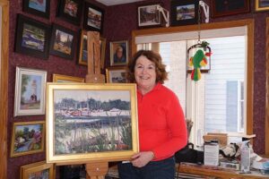 A “boats on the water” theme flows through many of Barbara Jablonski’s creations, which fill the walls of her Pittsford home